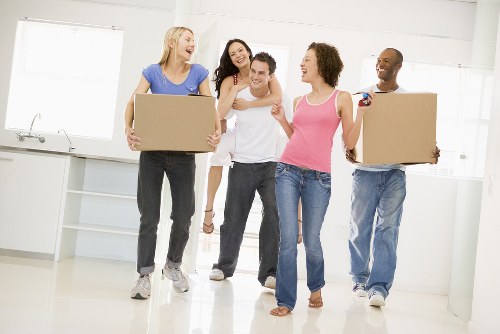 Mover loading household items for same day removals in Kingston