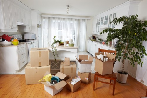 Packed office boxes and furniture ready for relocation in Kingston