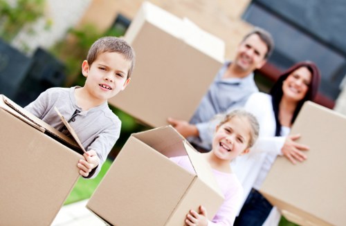 Professional Kingston moving team packing household items carefully