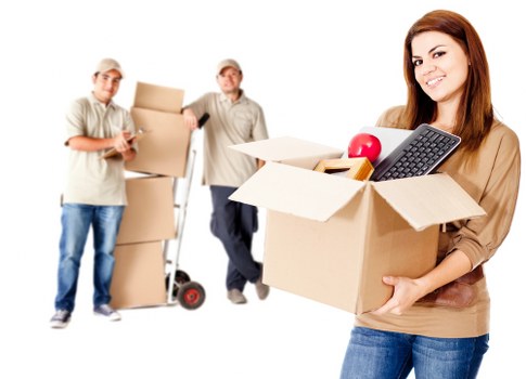 Professional movers handling furniture with care and teamwork