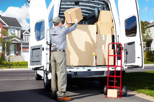 Professionals handling office equipment during a Kingston move
