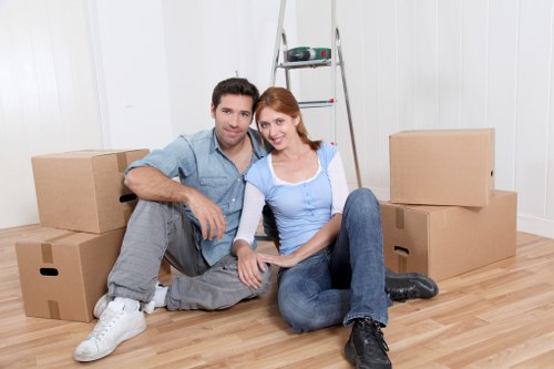 Moving team preparing household items for packing services in Kingston