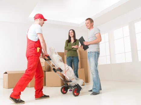 Professional movers handling business equipment in Kingston