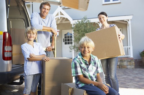 Professional movers packing boxes for a relocation in Kingston