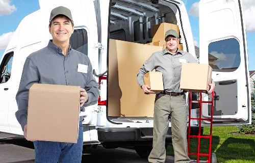 Local removal team handling furniture in a Kingston property