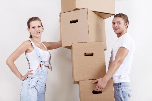 Business team preparing for office relocation in Kingston with labeled boxes