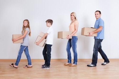 Organised packing materials and labelled office items for relocation
